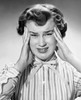 Portrait of a young woman suffering from a headache Poster Print - Item # VARSAL25510700B