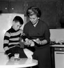 Mother dressing son's wound Poster Print - Item # VARSAL255417699