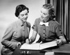 Close-up of two businesswomen discussing in an office Poster Print - Item # VARSAL2553087A