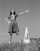Cheerleader with megaphone in meadow Poster Print - Item # VARSAL255422364