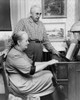 Senior woman playing a piano with a senior man standing beside her Poster Print - Item # VARSAL25548859