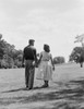 Young couple holding hands and walking Poster Print - Item # VARSAL255419363