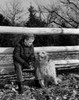 Boy with dog sitting on fence Poster Print - Item # VARSAL255416452