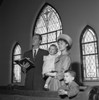 Family with daughter and son singing in church Poster Print - Item # VARSAL255420759