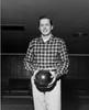 Young adult man holding a bowling ball Poster Print - Item # VARSAL25524288