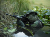 U.S. Navy SEAL crosses through a stream during combat operations Poster Print - Item # VARPSTTWE300052M