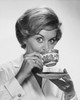 Portrait of a mid adult woman drinking from a tea cup Poster Print - Item # VARSAL25512680A