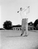 Young man playing golf Poster Print