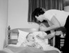 Mother giving medicine to sick boy in bed Poster Print - Item # VARSAL255419451