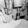 Young woman in bed yawning Poster Print - Item # VARSAL255417771