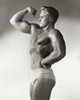 Side profile of young man flexing bicep Poster Print - Item # VARSAL2553053