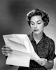 Studio shot of woman reading plan Poster Print - Item # VARSAL25549212