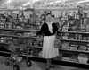 Woman doing shopping in supermarket Poster Print - Item # VARSAL255416663