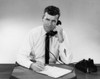 Businessman using telephone in office Poster Print - Item # VARSAL25548278