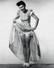 Portrait of a young woman lifting her skirt Poster Print - Item # VARSAL2552930