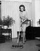 Young woman cleaning carpet Poster Print - Item # VARSAL25519094