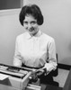 Businesswoman typing on a typewriter in an office Poster Print - Item # VARSAL25548421