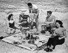 Two young couples at a picnic on the beach Poster Print - Item # VARSAL2551138B
