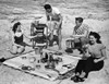Two young couples at a picnic on the beach Poster Print - Item # VARSAL2551138B
