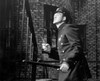 Side profile of a policeman holding a gun and a stick near a staircase Poster Print - Item # VARSAL25526105