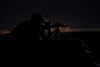 Partially silhouetted U.S. Marine on a bunker in Northern Afghanistan Poster Print - Item # VARPSTTMO100559M