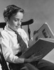 Boy sitting in a chair and reading a book Poster Print - Item # VARSAL25513110
