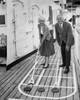 Senior couple playing shuffleboard on a cruise ship Poster Print - Item # VARSAL25548953