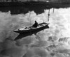 High angle view of a man sitting on a rowboat and fishing in a lake Poster Print - Item # VARSAL25539990