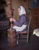 Side profile of a senior woman sitting and churning butter Poster Print - Item # VARSAL34564584
