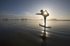 Silhouette Of Female Surfer Doing Bow Pulling Yoga Pose; Chesterman Beach Tofino Vancouver Island British Columbia Canada PosterPrint - Item # VARDPI1938903