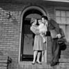 Businessman saying goodbye to wife and young daughter as he goes out to work Poster Print - Item # VARSAL255421970