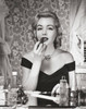 Portrait of a young woman applying lipstick Poster Print - Item # VARSAL2554287