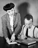 Businessman undergoing a manual dexterity test with a businesswoman standing beside him Poster Print - Item # VARSAL25526243