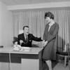 Businessman and secretary laughing in office Poster Print - Item # VARSAL255421980