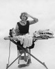 Young woman ironing on clothes Poster Print - Item # VARSAL25515457B