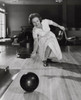 Mature woman bowling in a bowling alley Poster Print - Item # VARSAL25518590A