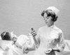 Female nurse giving syrup to patient Poster Print - Item # VARSAL255416273