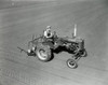 High angle view of a farmer plowing a field with a tractor Poster Print - Item # VARSAL25518495