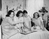 Four teenage girls looking at a photo album Poster Print - Item # VARSAL25511742