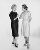 Two mid adult women talking to each other Poster Print - Item # VARSAL25549093
