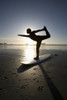 Silhouette Of Female Surfer Doing Bow Pulling Yoga Pose; Chesterman Beach Tofino Vancouver Island British Columbia Canada PosterPrint - Item # VARDPI1938900