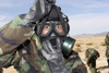 November 22, 2005 - Rifleman puts on his gas mask at the Combat Center'rs Range 105. Poster Print - Item # VARPSTSTK102046M