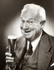 Portrait of a senior man holding a glass of beer Poster Print - Item # VARSAL2554223