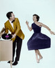 Young man holding record looking at young woman dancing Poster Print - Item # VARSAL2553190A
