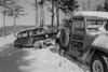 USA  Pennsylvania  Man connecting tow rope to car in snow Poster Print - Item # VARSAL255423430