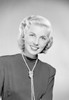 Studio portrait of young woman smiling Poster Print - Item # VARSAL255420197