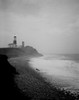 Lighthouse on seashore Poster Print