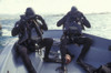 Navy SEALs combat swimmers in a utility boat adjust their dive masks Poster Print - Item # VARPSTWOD100143M