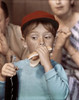 Close-up of a boy eating a hot dog and holding a bottle of soda Poster Print - Item # VARSAL3811361954