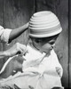 Mother cutting her son's hair Poster Print - Item # VARSAL25519791